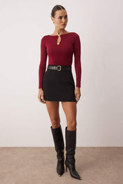 Stand out with AtikaStyle’s burgundy long sleeve top featuring chic gold button accents and a front keyhole detail—perfect for evening outfits or elevated casual looks.