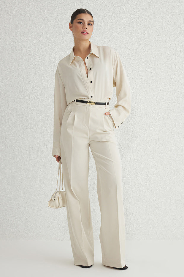 Shop the Atikastyle High-Waisted Beige Wide-Leg Trousers – elegant tailored pants perfect for office wear, smart-casual looks, and everyday chic.
