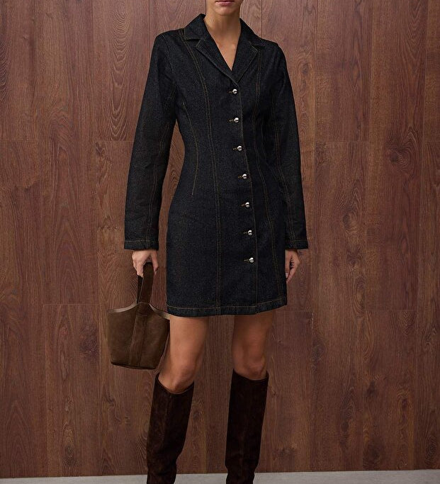	•	Woman wearing dark denim button-front mini dress – AtikaStyle
	•	Close-up of pearl-style buttons on denim mini dress – AtikaStyle
	•	Dark denim collared long-sleeve mini dress front view – AtikaStyle
