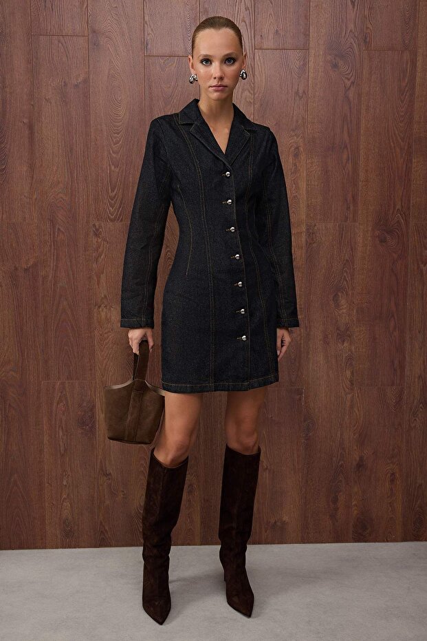 	•	Woman wearing dark denim button-front mini dress – AtikaStyle
	•	Close-up of pearl-style buttons on denim mini dress – AtikaStyle
	•	Dark denim collared long-sleeve mini dress front view – AtikaStyle
