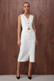 	•	Woman wearing white sleeveless button-front belted midi dress – AtikaStyle
	•	Front view of elegant white midi dress with gold buttons – AtikaStyle
	•	White belted sleeveless dress styled with black heels – AtikaStyle
