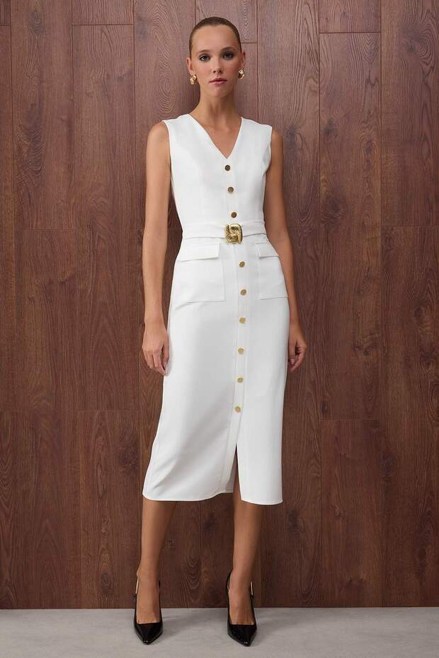 	•	Woman wearing white sleeveless button-front belted midi dress – AtikaStyle
	•	Front view of elegant white midi dress with gold buttons – AtikaStyle
	•	White belted sleeveless dress styled with black heels – AtikaStyle
