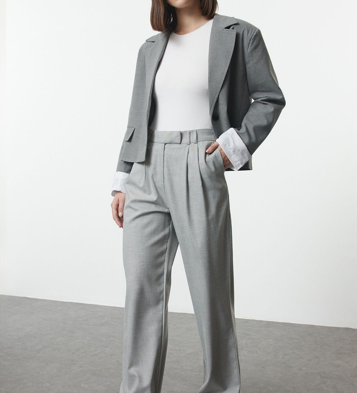Step up your style game with our Women’s Light Grey Wide-Leg Trousers. These minimalist, high-waisted pants offer a flattering fit and versatile design, perfect for both office and casual wear.