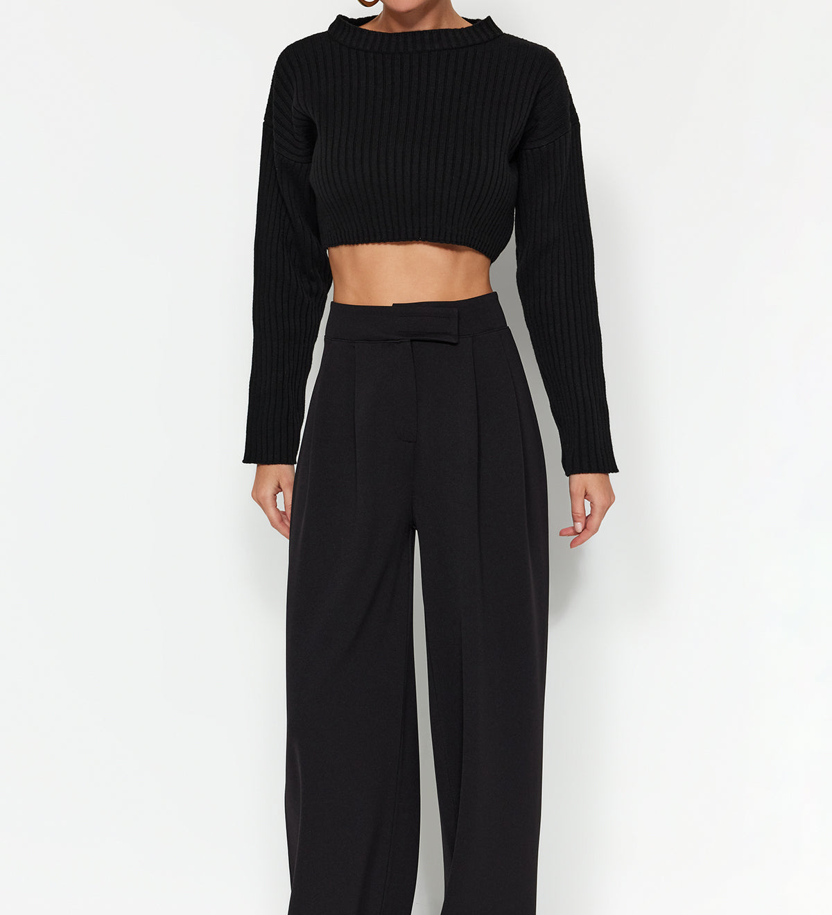 Elevate your style with our High-Waisted Wide Leg Trousers in black. These pleated dress pants offer a sophisticated, relaxed fit perfect for any occasion. Shop now for a timeless wardrobe staple!

