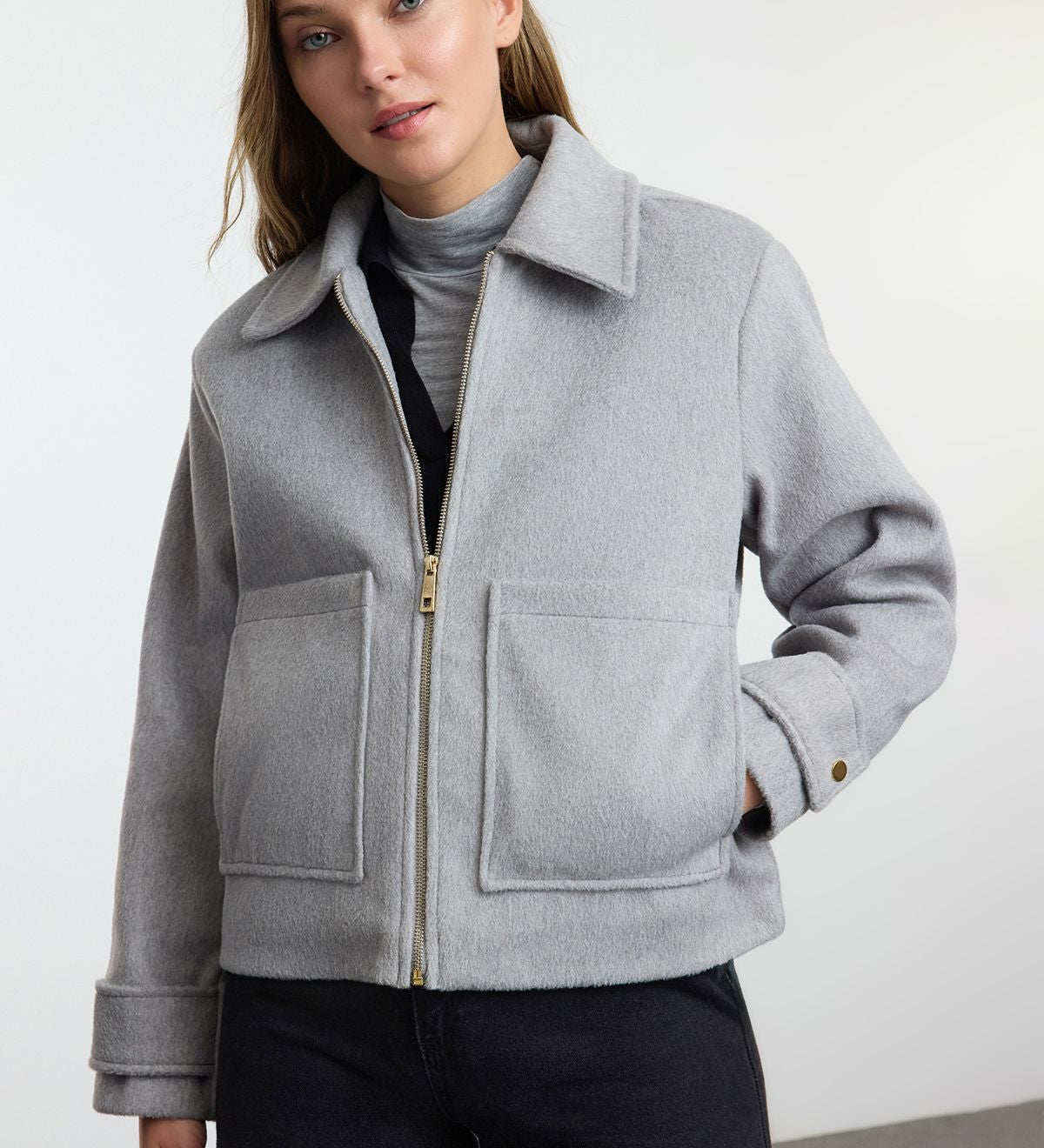 Upgrade your winter wardrobe with this classic gray wool blend zip-up jacket. Perfect for layering, it offers a warm and stylish touch to any outfit.