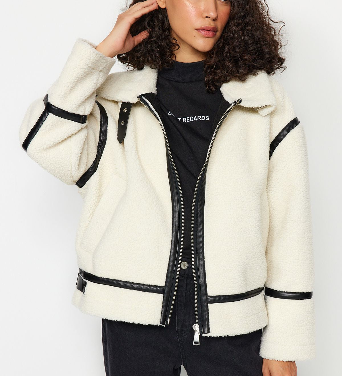 Shop our Women’s Faux Shearling Jacket with sleek faux leather trim. Stay warm and stylish this winter with this cozy, fashionable jacket, perfect for casual or semi-formal looks.
