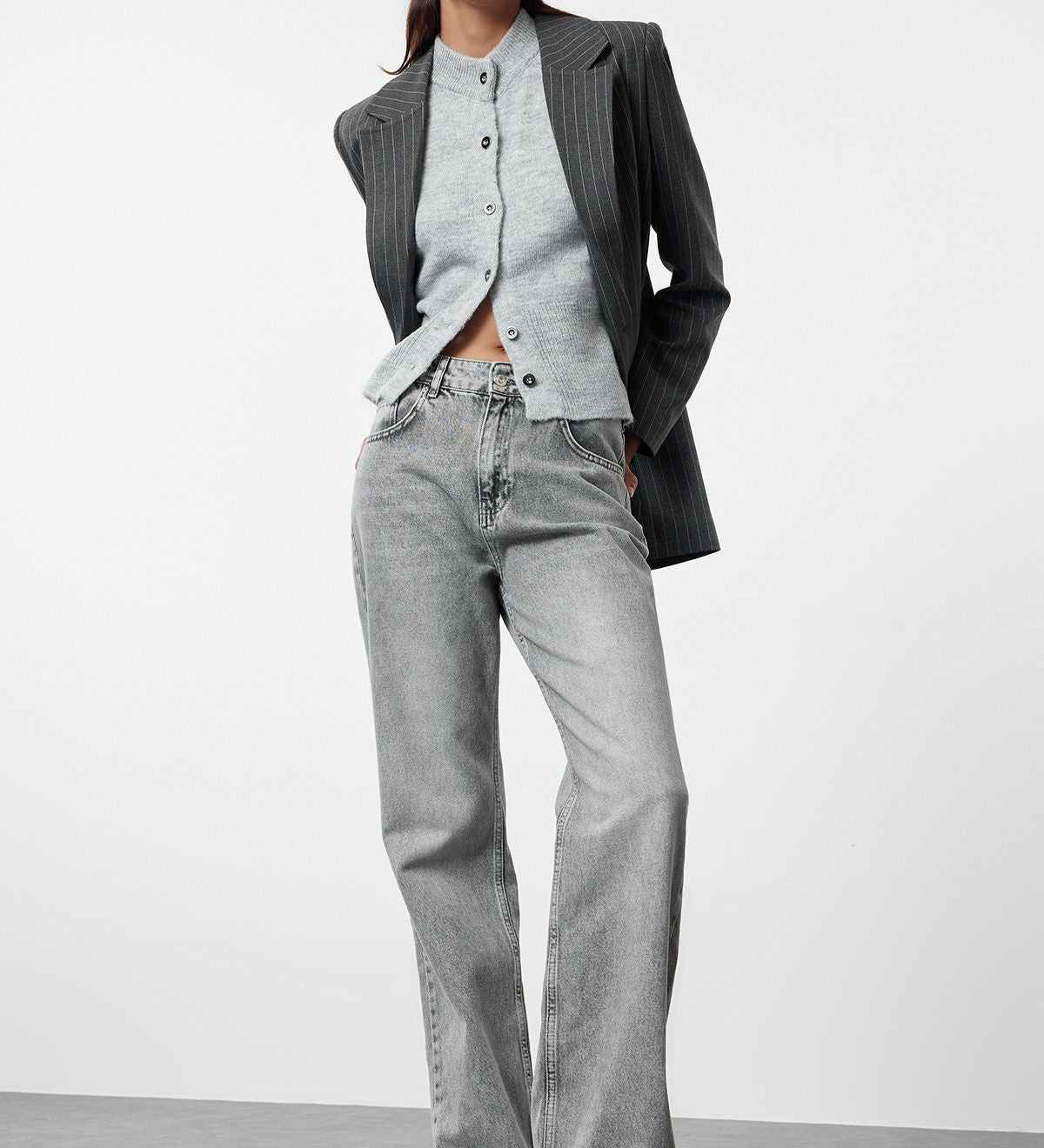 Shop our Vintage Gray High-Waisted Wide-Leg Jeans for the ultimate combination of comfort and style. These versatile, street-style jeans feature a flattering high-rise fit and relaxed wide-leg silhouette, perfect for any casual look. Available now!