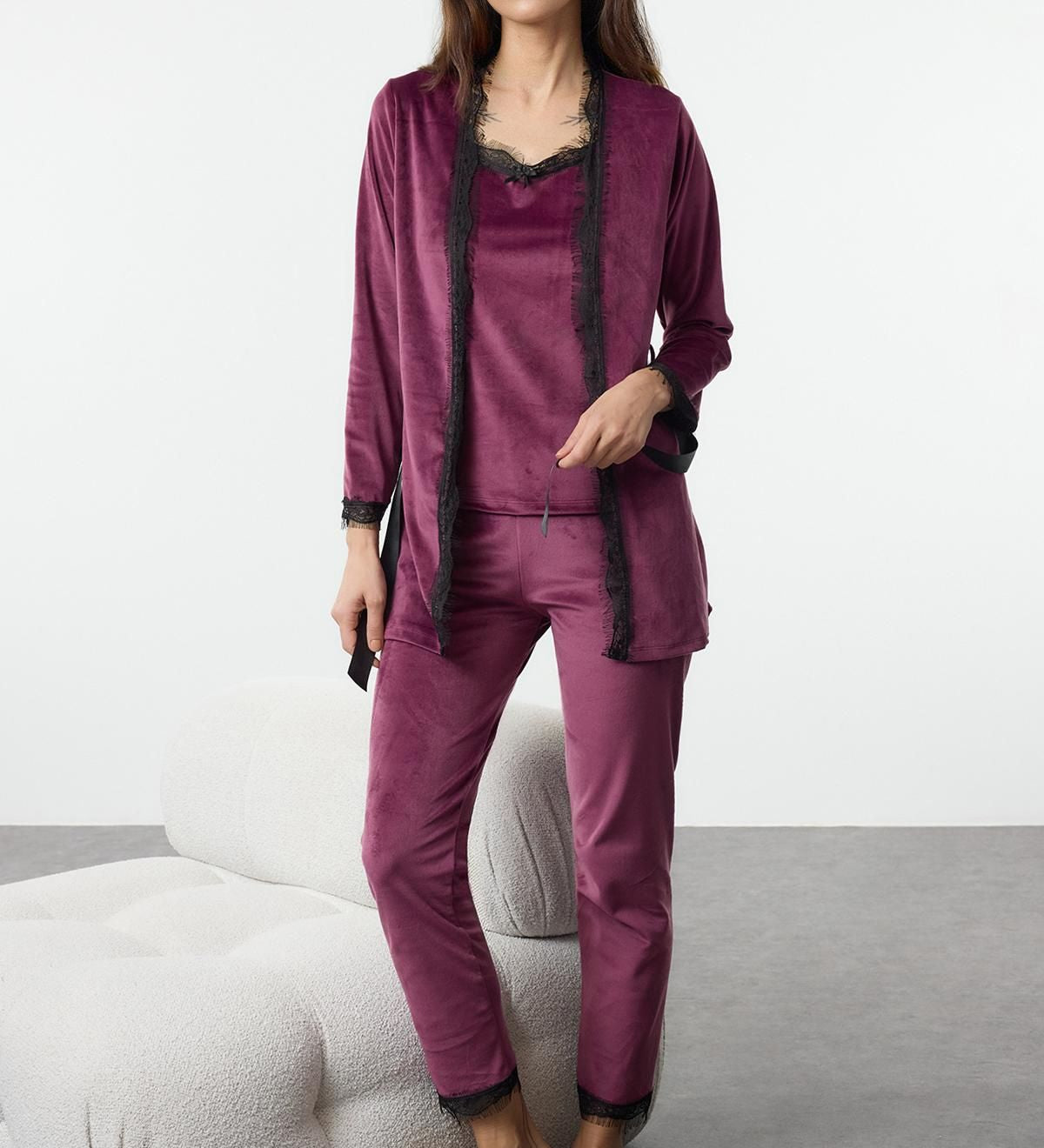 Relax in style with this luxurious burgundy velvet lounge set featuring delicate lace trim. Perfect for cozy nights or elegant loungewear looks