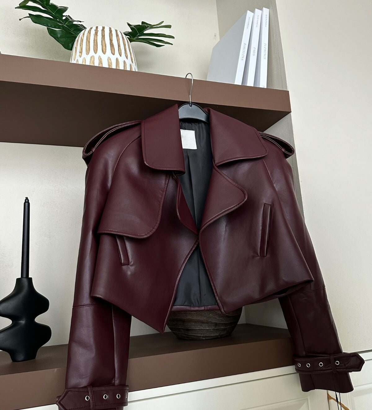 Cropped Burgundy Faux Leather Jacket – Trendy Outerwear for Women 
Explore our cropped burgundy faux leather jacket with oversized lapels and belted cuffs. The perfect blend of bold and stylish outerwear for your wardrobe.