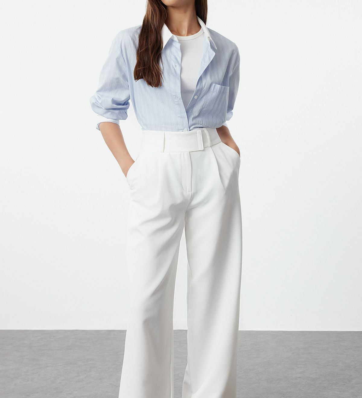 Elevate your style with these elegant high-waist wide-leg white trousers for women. Perfect for office wear or casual outings, these versatile pants offer comfort and sophistication. Shop now for a chic wardrobe essential!