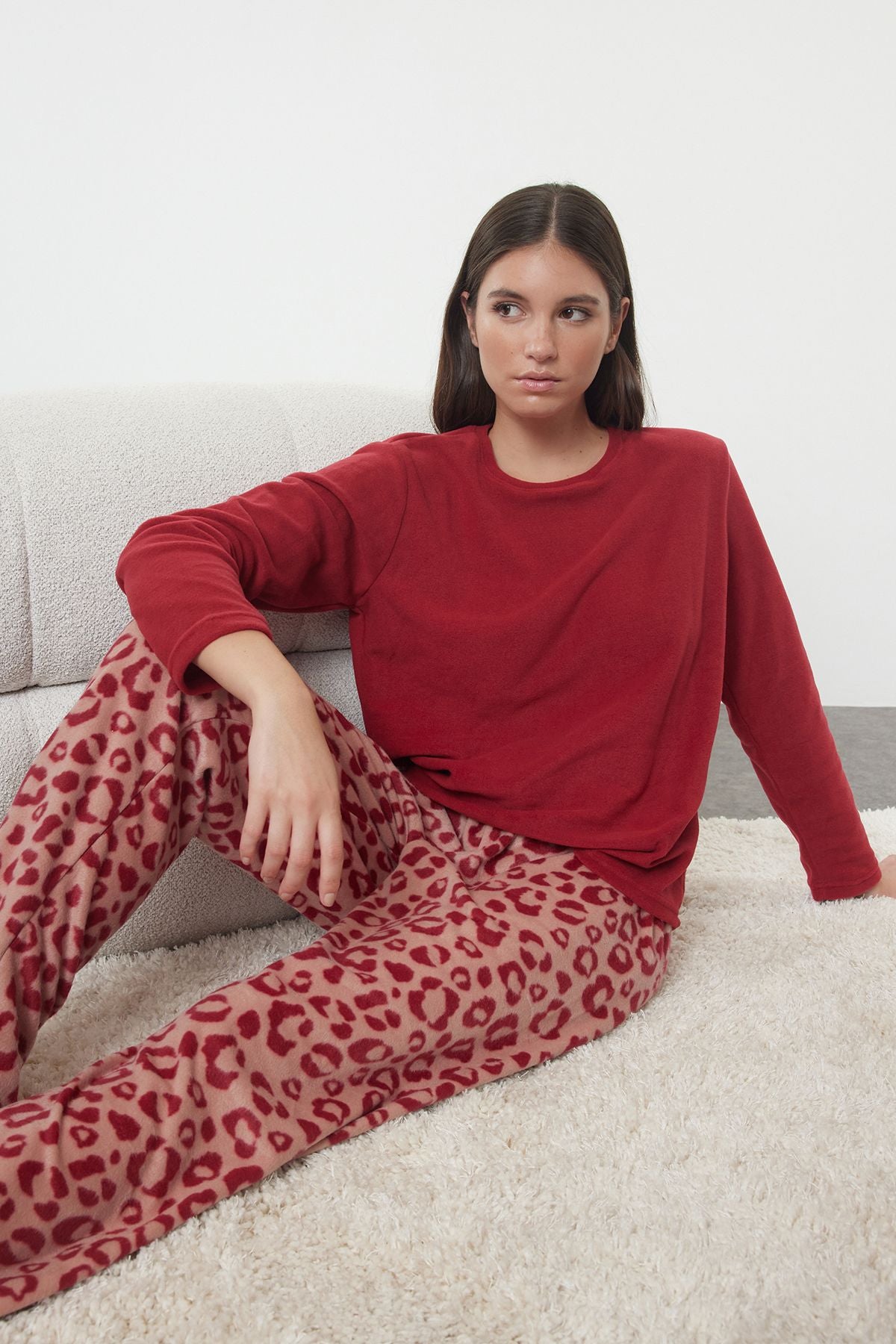 Get cozy in our red leopard print fleece pajama set. Featuring a soft fleece top and stylish printed pants, perfect for winter nights or lounging at home. Shop now!