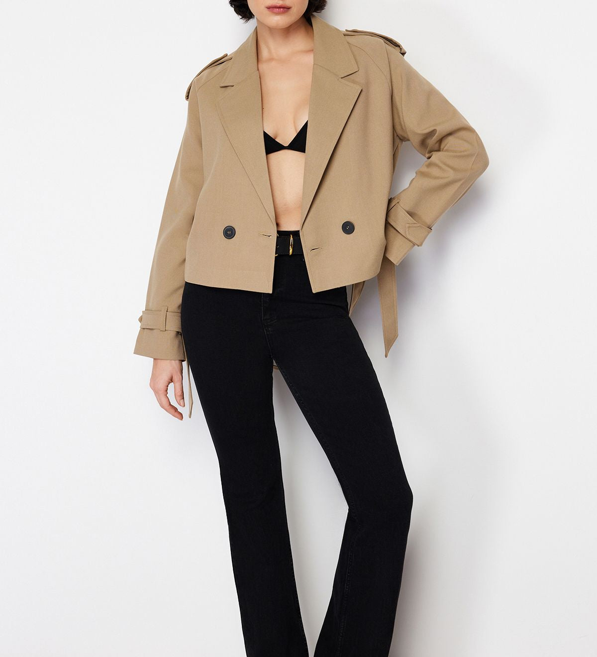 Elevate your wardrobe with our cropped belted camel trench jacket, designed for style and comfort. This lightweight outerwear features a tailored fit, flattering waist belt, and timeless design—perfect for any occasion. Shop now for the latest in women’s fashion outerwear.