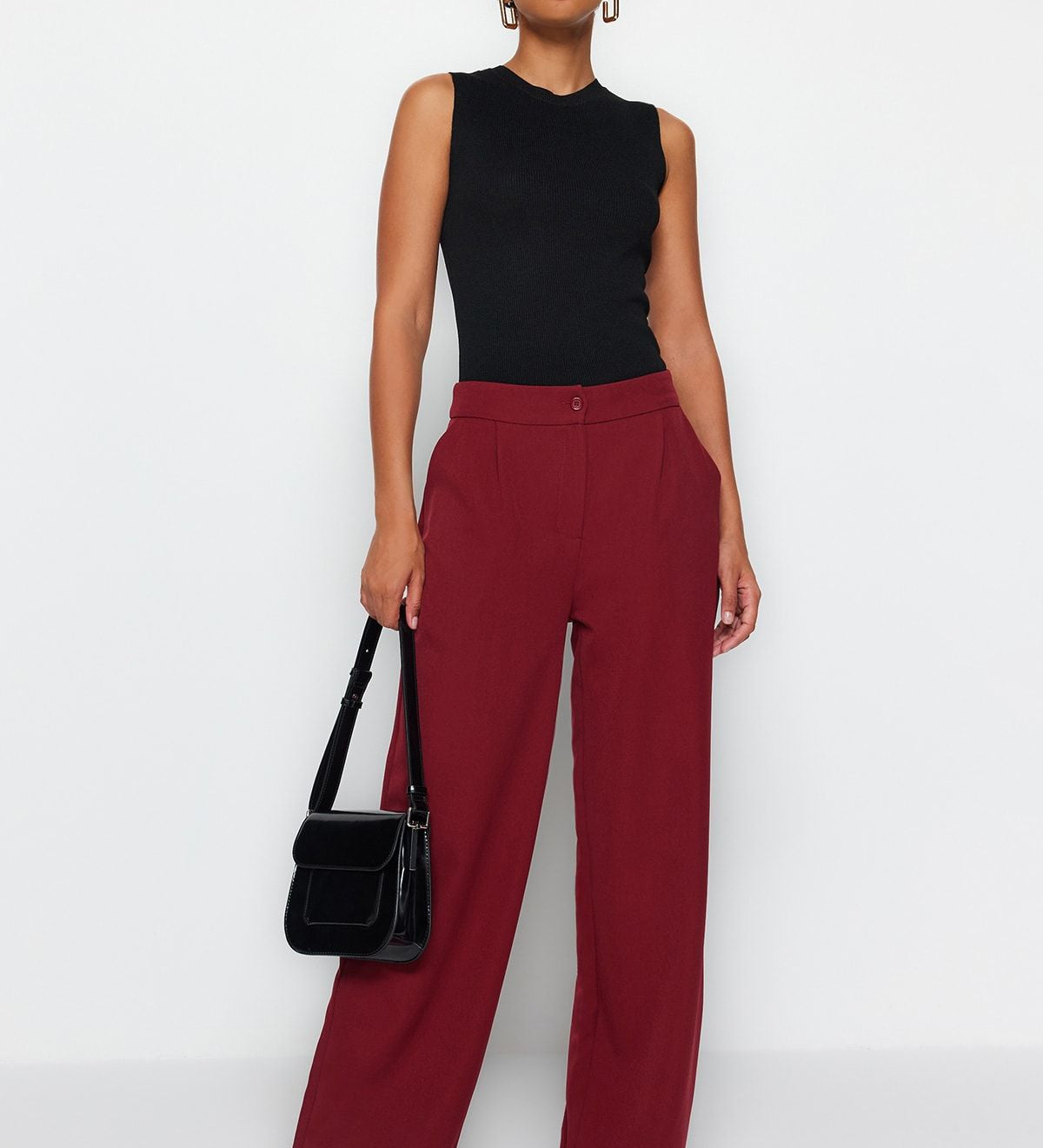 Discover sophisticated style with our High-Waisted Wide Leg Trousers in burgundy. These tailored pants offer a chic, versatile look perfect for work or casual wear. Shop now for a refined wardrobe update!