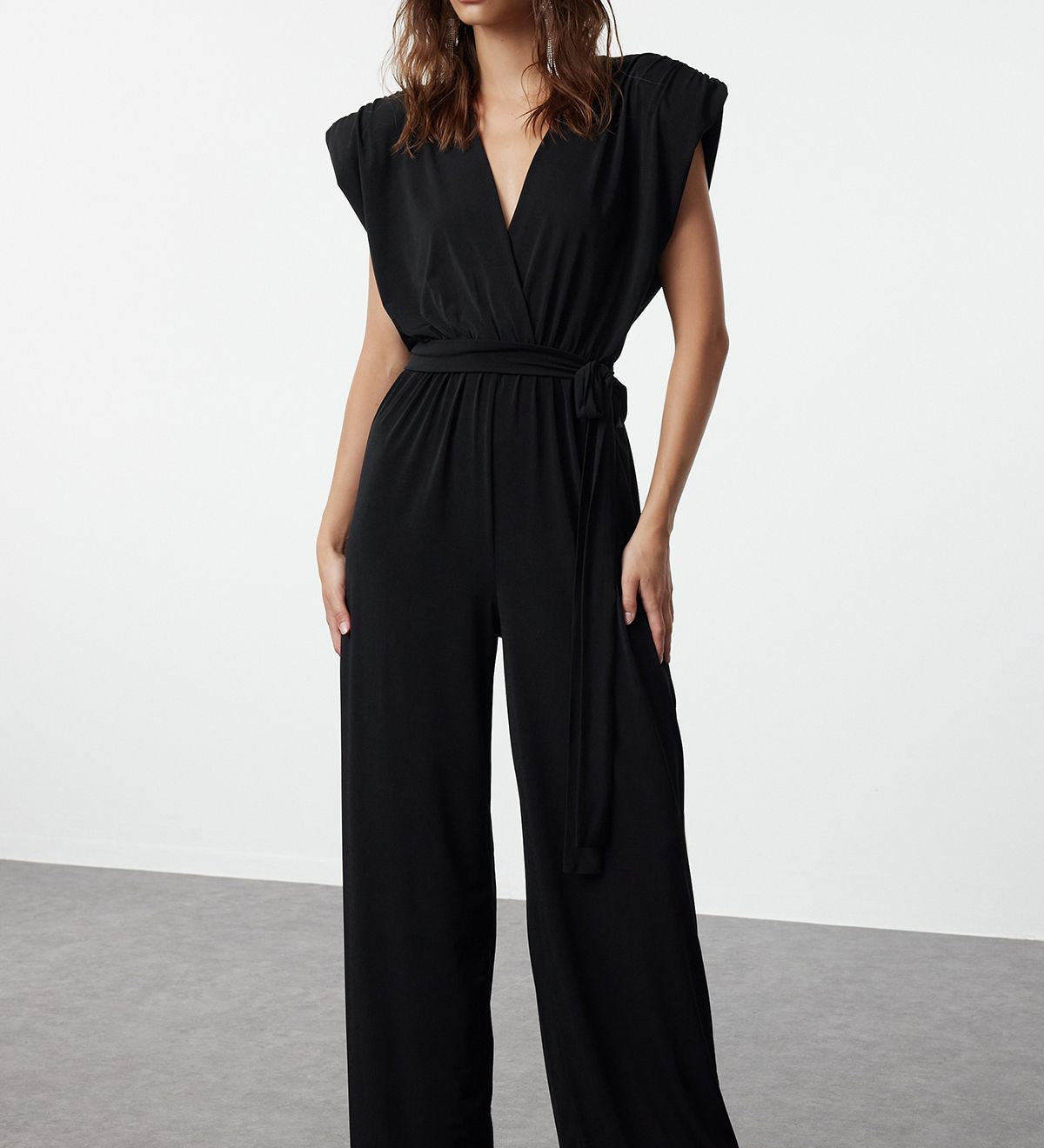 Shop this elegant black wide-leg jumpsuit with a belted waist. Perfect for formal events or chic evenings out. Sophisticated, modern, and effortlessly stylish!