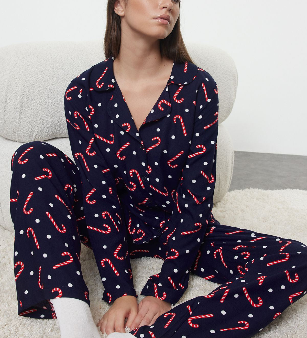 Get festive with our women’s candy cane print pajama set. Perfect for holiday mornings and cozy nights, featuring a fun polka dot design. Shop now for the season!