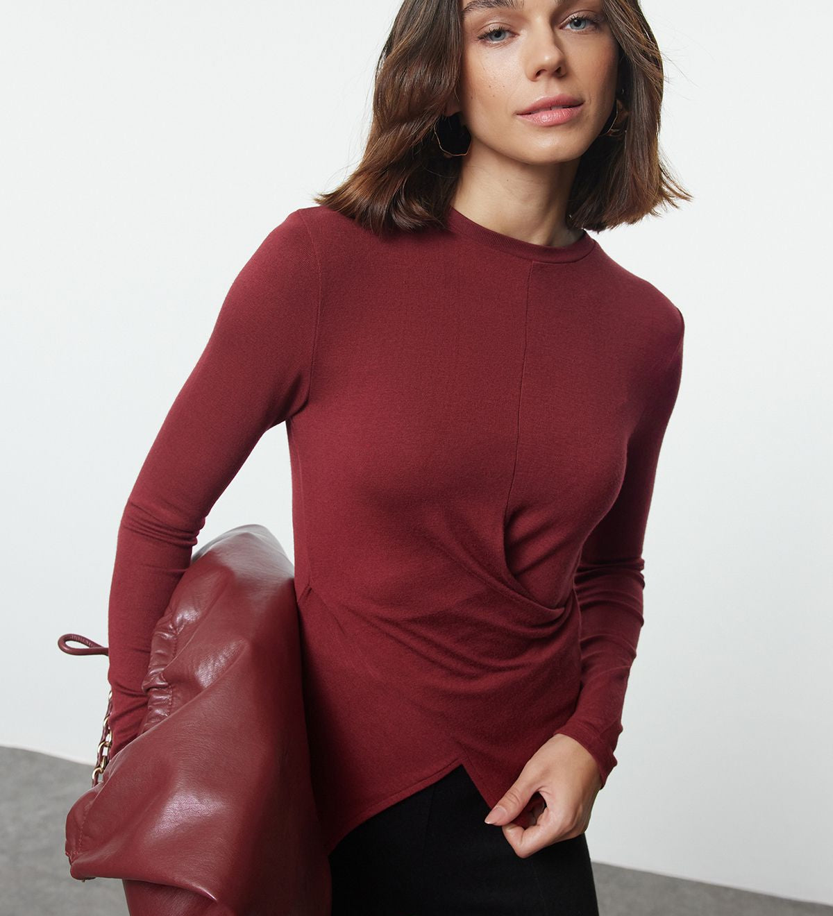 
Elevate your style with our Asymmetric Twist-Front Long Sleeve Top in burgundy. This chic blouse features a unique draped front and modern asymmetric hem. Perfect for any occasion, shop now!

