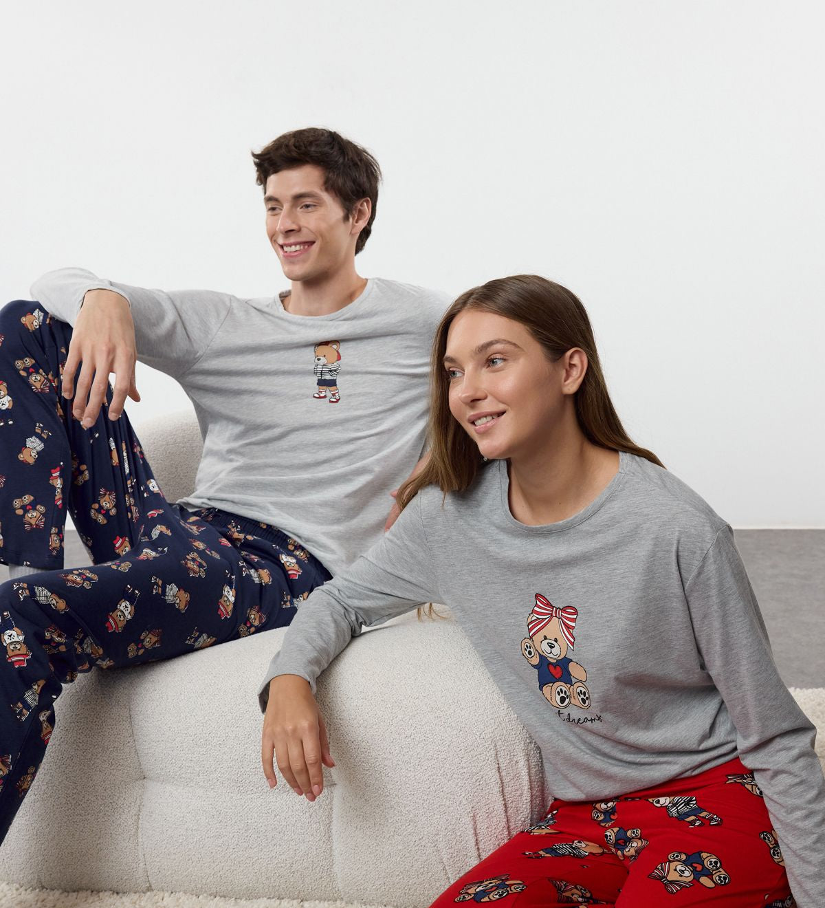 Stay cozy with our women’s bear print pajama set. Featuring a cute grey top with bear graphics and red printed pants, perfect for bedtime or lounging. Shop now!
