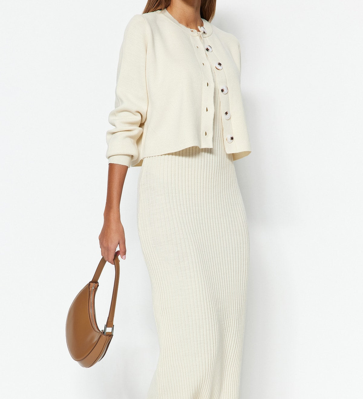 Discover the Cream Ribbed Knit Cardigan and Midi Dress Set for effortless style and comfort. Perfect for any occasion, this versatile outfit is a must-have addition to your wardrobe