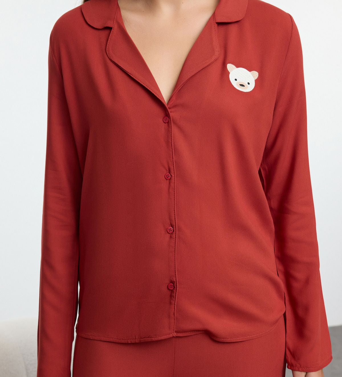 Minimalist red pajama set for women
	•	Button-up lounge set with bear graphic
	•	Cozy women’s two-piece sleepwear
	•	Relaxed fit pajamas for women
	•	Lightweight red pajama set with top and pants
	•	Women’s lounge outfit for home
	•	Cute bear detail sleepwear gift
	•	Comfortable sleepwear for women
	•	Relaxed button-up sleep set
	•	Stylish pajamas for lounging