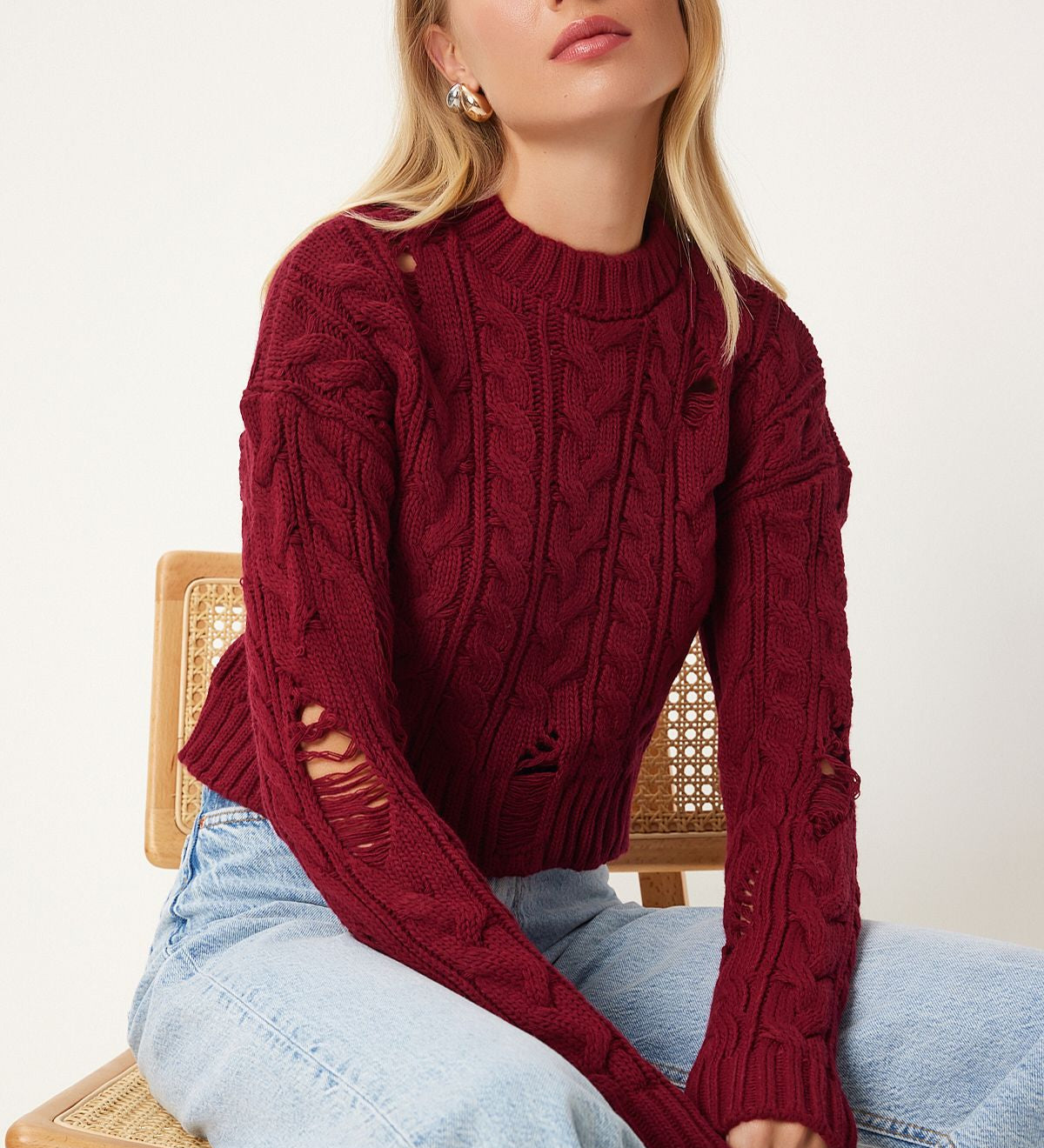 Stand out with our Distressed Cable Knit Sweater in rich burgundy. Featuring chunky knit and unique distressed details, this cozy pullover is perfect for any stylish fall or winter look. Shop now for a bold fashion statement free shipping!