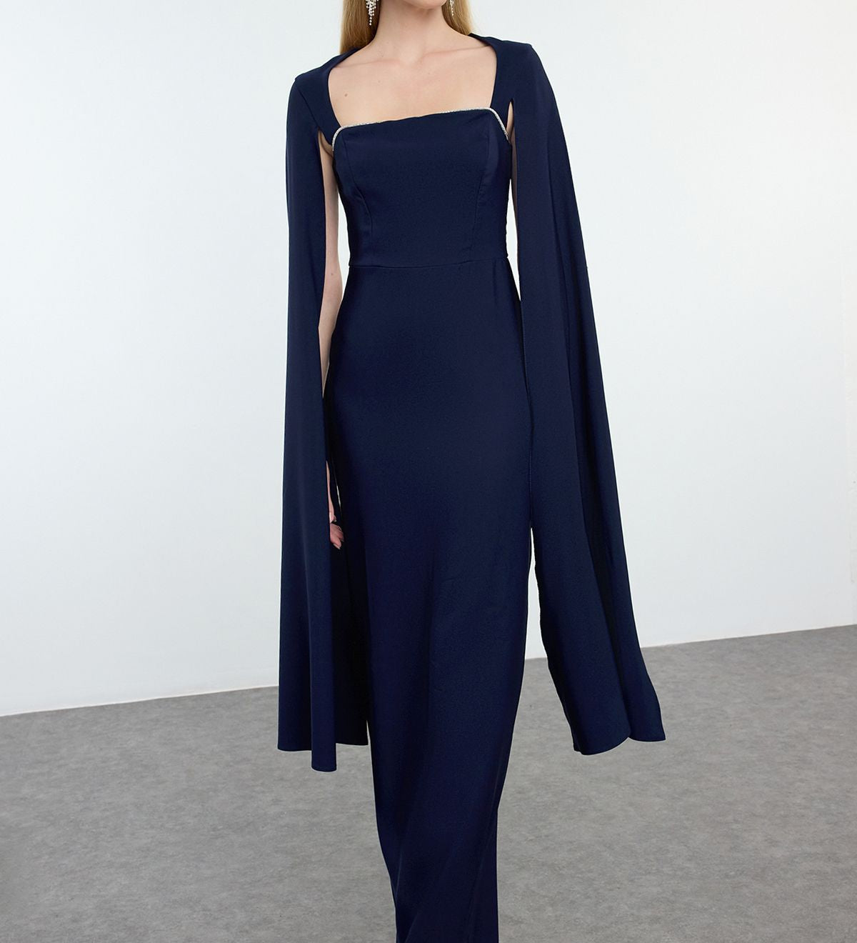             Navy blue evening gown
	•	Cape sleeve formal dress
	•	Elegant evening gown for     
             women
	•	Floor-length formal dress
	•	Sophisticated evening wear