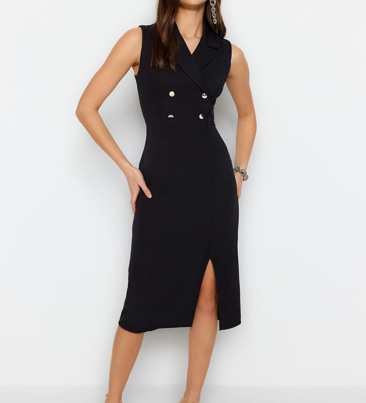 Discover our Elegant Black Double-Breasted Sleeveless Midi Dress, perfect for formal events or evening outings. A stylish blend of classic and modern, available in various sizes.