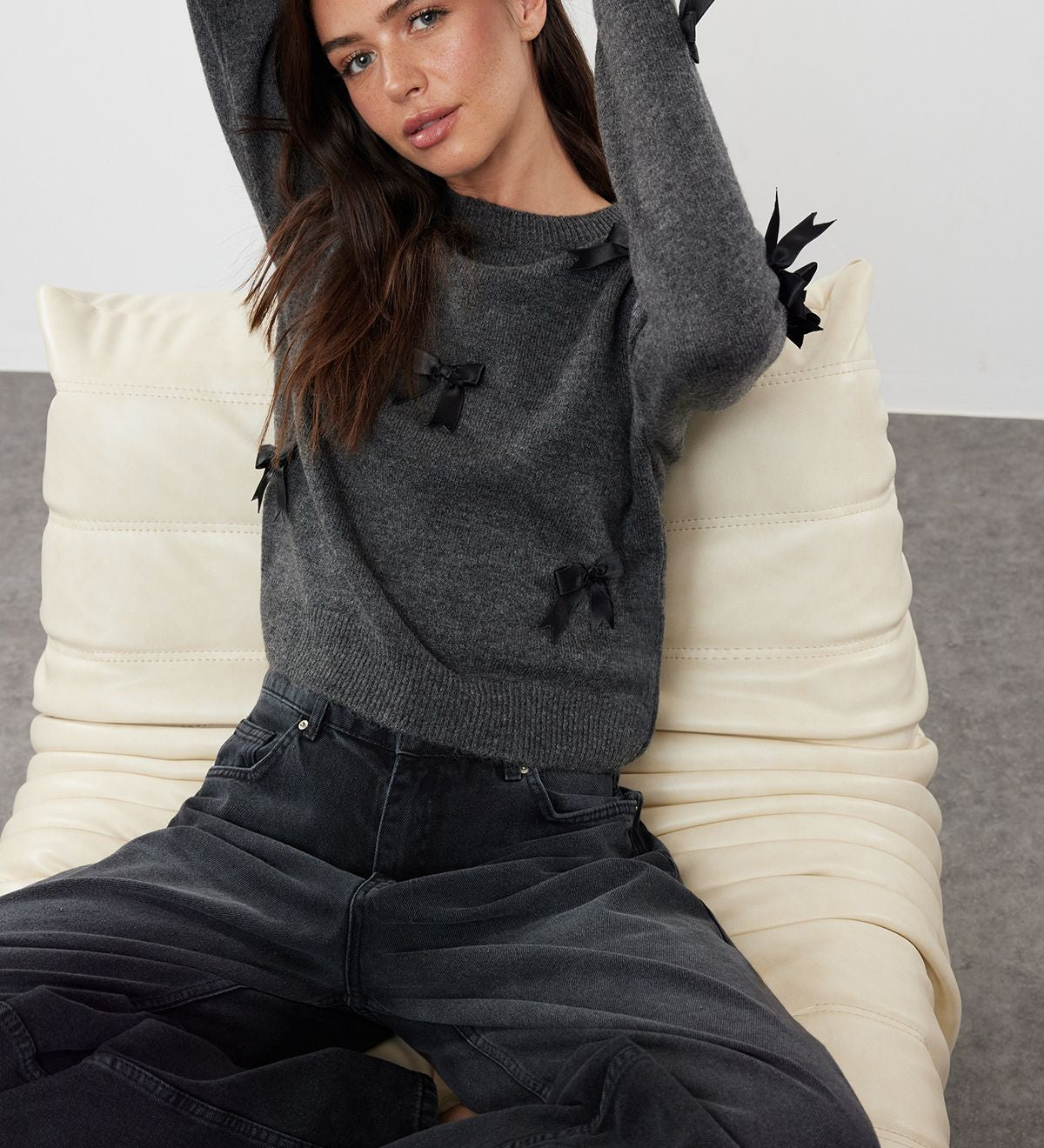 charcoal sweater with bows, stylish bow sweater, women’s knit sweater with bow accents, chic gray sweater, cozy fashion sweater, unique sweater design, feminine sweater for women, trendy knitwear

