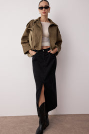 	•	Woman wearing black denim slit maxi skirt with boots – AtikaStyle
	•	Front view of black denim high-waist maxi skirt with slit – AtikaStyle
	•	Street style outfit featuring black slit denim maxi skirt – AtikaStyle
