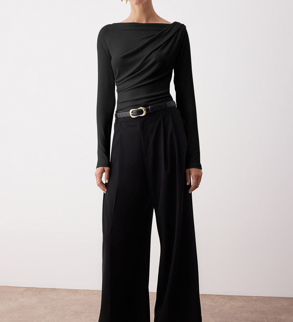  Elegant woman wearing black draped one-shoulder long sleeve top – stylish evening blouse by AtikaStyle
