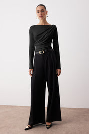  Elegant woman wearing black draped one-shoulder long sleeve top – stylish evening blouse by AtikaStyle
