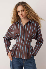  Woman wearing a brown and blue striped corset-waist button-up blouse with tailored pleats – AtikaStyle.”
