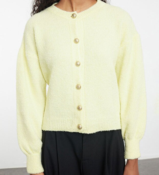 Brighten your wardrobe with this pastel yellow cardigan. Soft knit fabric with button-up closure makes it perfect for layering or wearing solo. Made in Turkey – AtikaStyle.