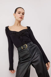 Black ruffle blouse – angled view, V-neck long sleeve