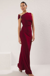 Turn heads in AtikaStyle’s burgundy one-shoulder evening gown, featuring crystal embellishments, a sleek bodycon fit, and floor-length elegance—perfect for weddings, galas, and formal events.