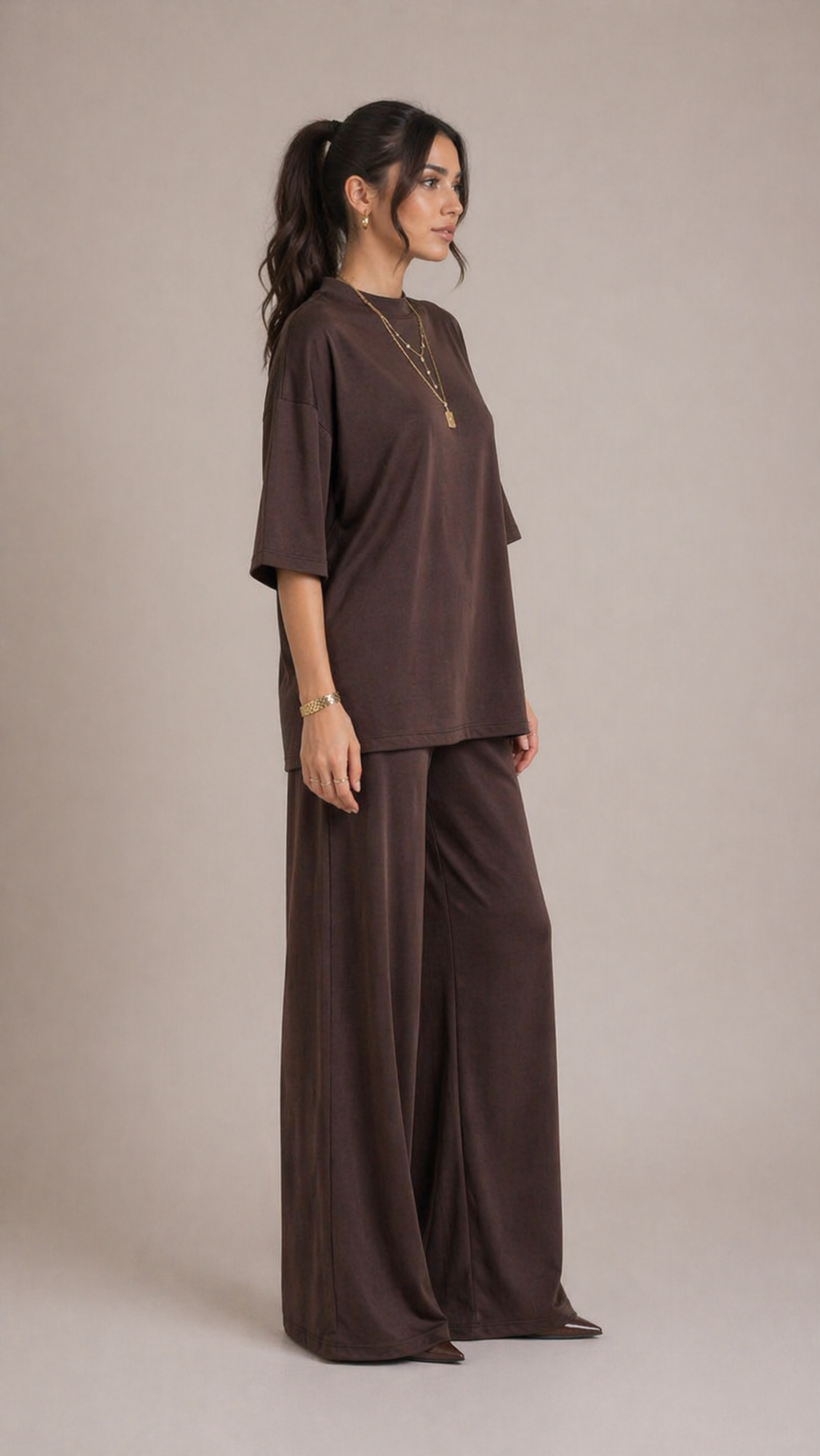 Side view of brown two-piece lounge set with relaxed fit top and flowy wide-leg pants