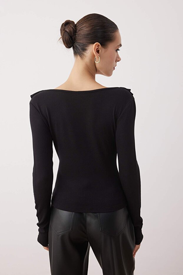 Back view – black fitted long sleeve blouse