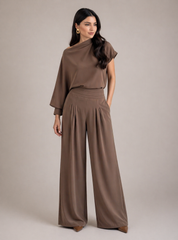 Woman wearing mocha satin two piece set with draped top and wide-leg pants chic evening outfit