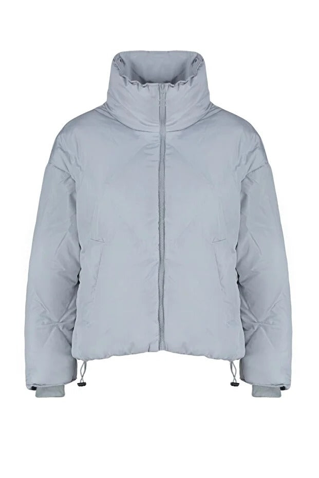 Light gray puffer jacket on a white background