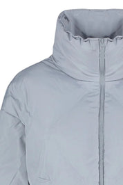 Close-up of a light gray jacket with a zipper on a white background