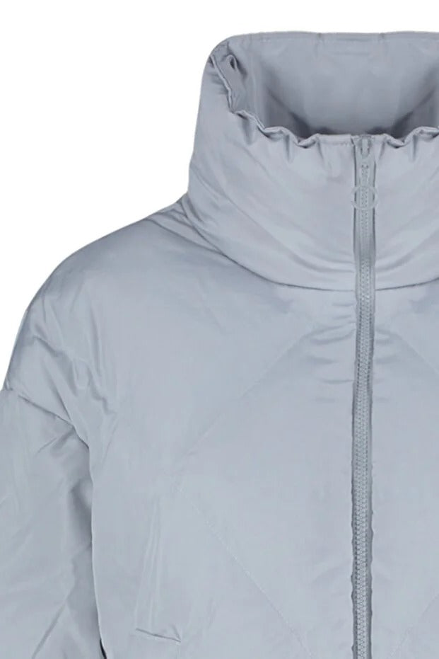 Close-up of a light gray jacket with a zipper on a white background