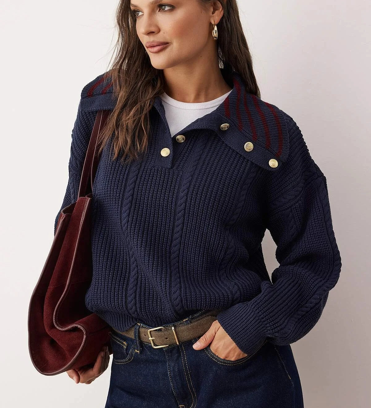 Navy chunky knit sweater with gold shoulder buttons on model – AtikaStyle”
