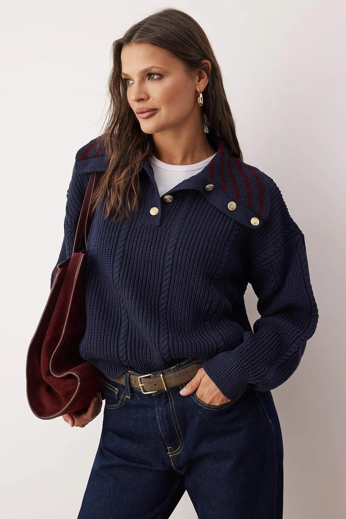 Navy chunky knit sweater with gold shoulder buttons on model – AtikaStyle”
