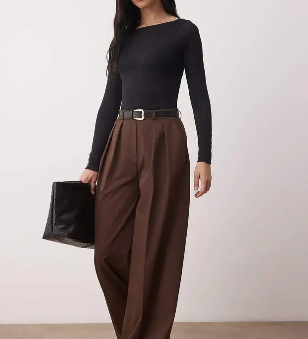 Woman wearing chocolate brown high-waist wide-leg tailored trousers with flowy drape – AtikaStyle.”
