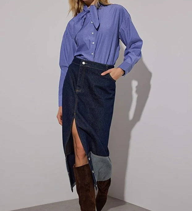 Effortless sophistication — this blue pinstripe tie-neck blouse from AtikaStyle blends classic tailoring with feminine charm. Perfect for work or weekend chic.”
