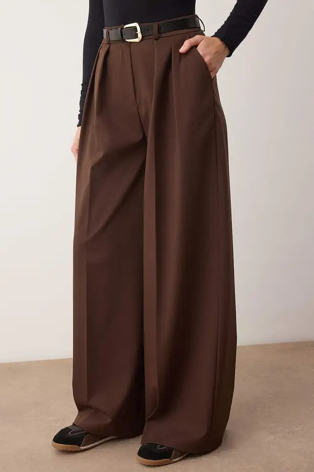 Brown wide-leg pants worn by a person on a plain background