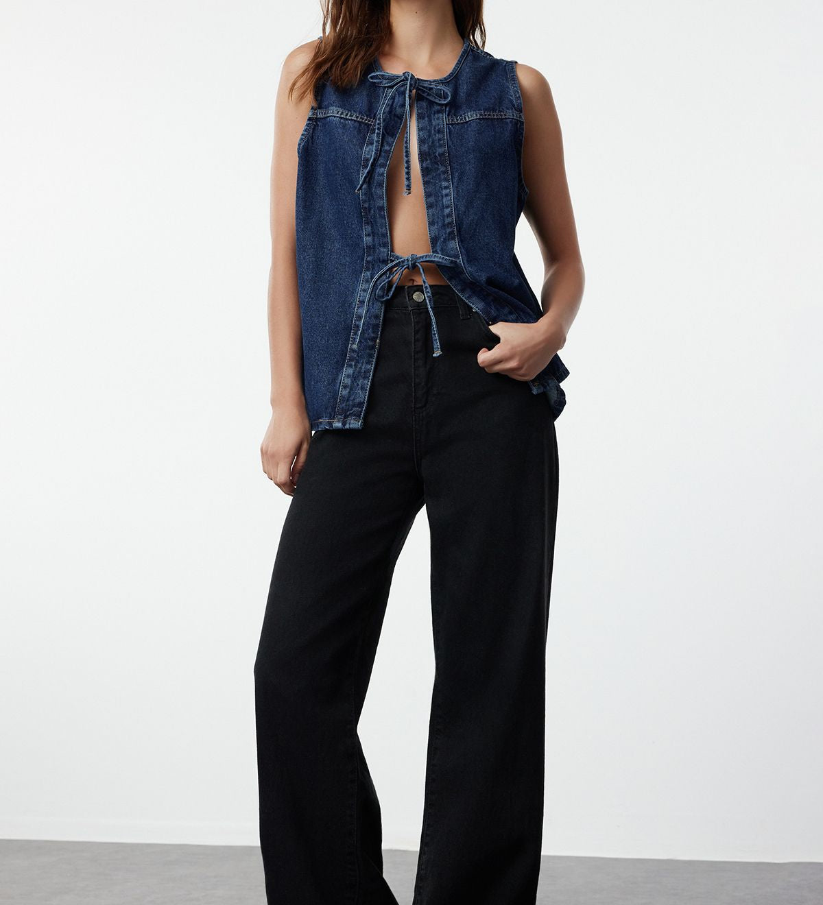 Discover our Classic Denim Vest, a versatile and stylish layering piece perfect for any casual outfit. Crafted from durable denim with a front tie closure, this sleeveless vest is a must-have addition to your wardrobe. Shop now for effortless style enjoy free shipping!