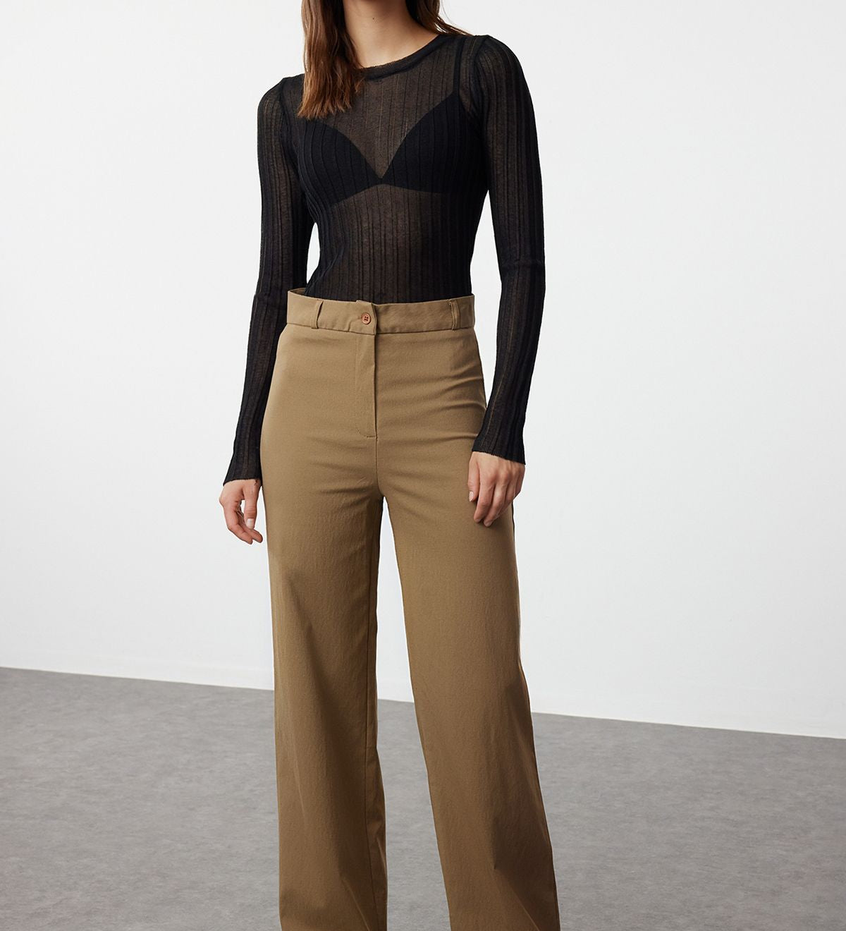  
Elevate your style with our High-Waisted Wide-Leg Trousers. Featuring a flattering high waist, wide-leg fit, and versatile brown color, these sophisticated pants are perfect for any occasion. Shop now for chic and comfortable women’s trousers!