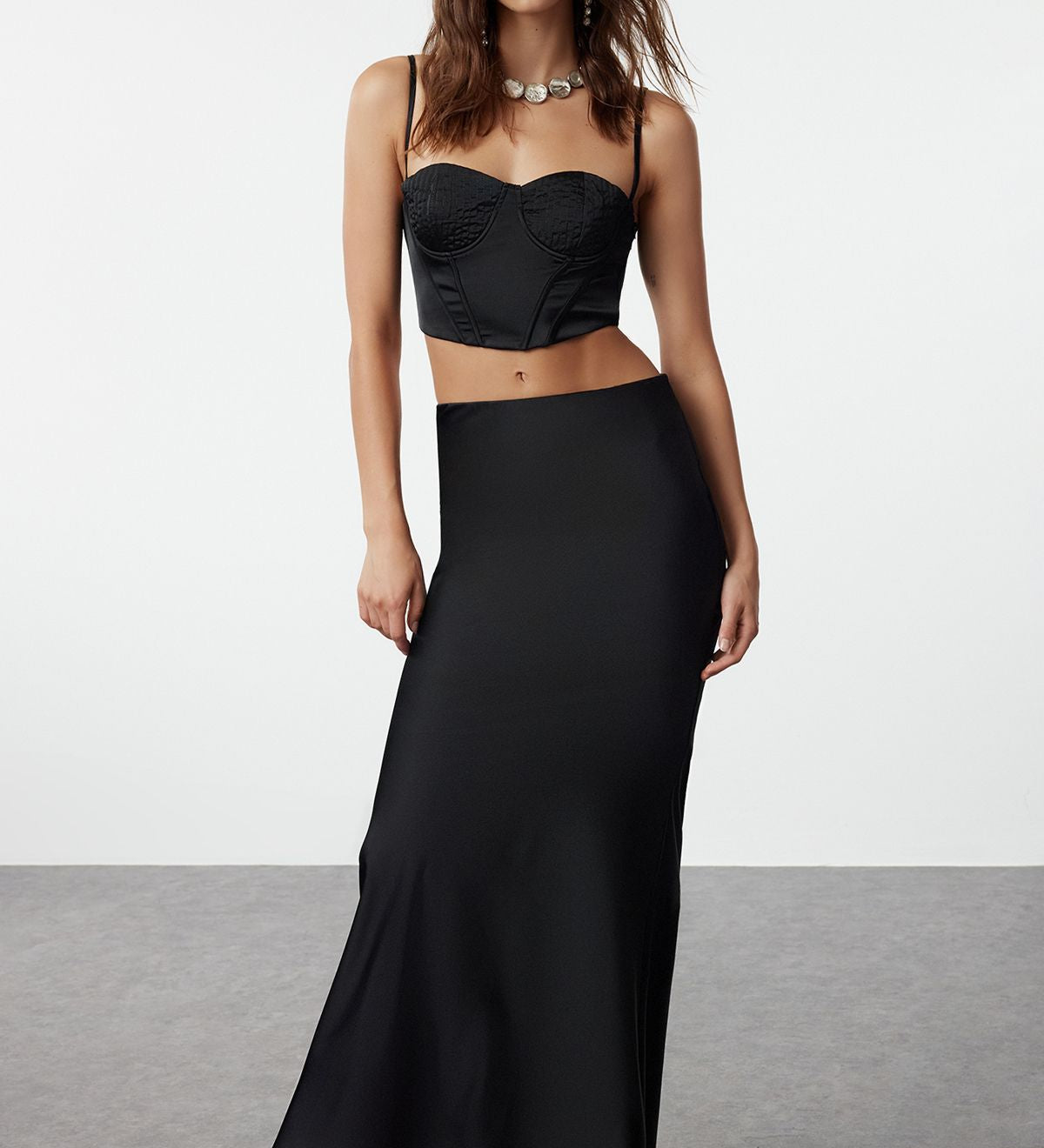 
Shop our elegant black bustier and maxi skirt set, perfect for evening events and special occasions. This sophisticated two-piece ensemble features a fitted bustier top and a sleek maxi skirt, offering modern elegance and timeless style.