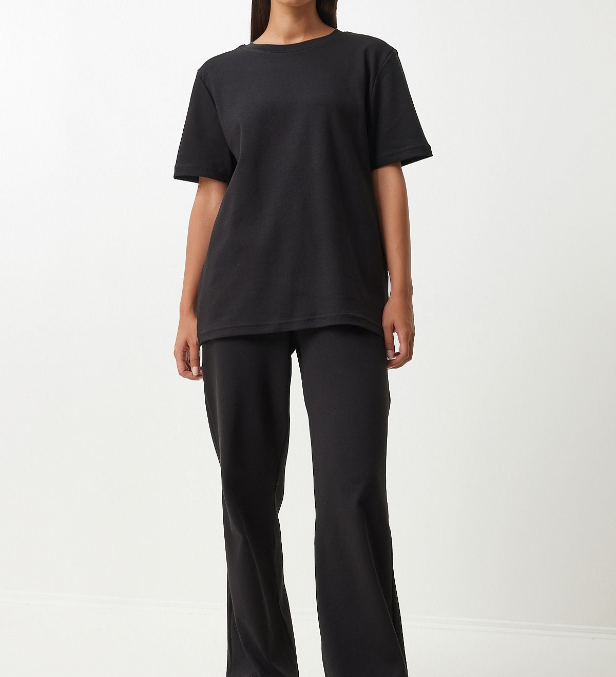  Embrace comfort and style with our Classic Black Loungewear Set. Featuring a relaxed-fit T-shirt and wide-leg pants, this sleek and versatile set is perfect for lounging or casual outings. Shop now for stylish and comfortable loungewear!