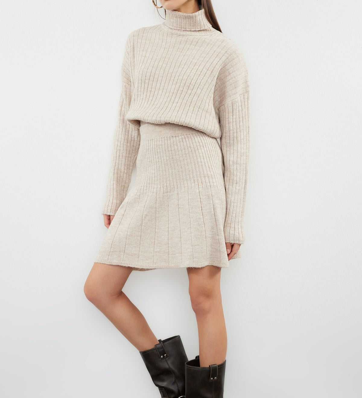  
Enhance your winter style with our Beige Ribbed Turtleneck Sweater and Skirt Set. Featuring a cozy turtleneck sweater and matching ribbed skirt, this elegant set is perfect for staying warm and chic. Shop now for a sophisticated and comfortable winter outfit!